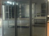 a picture of a commercial refrigerator in a building
