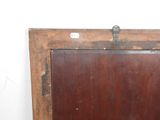 a picture of an old wooden frame with a picture on it