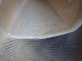 a close up of a white bowl with writing on it