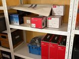 a lot of boxes on the shelves in the room