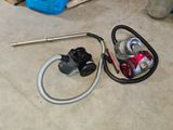 an image of a vacuum and a hose on the floor