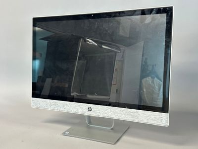 a computer monitor sitting on top of a desk
