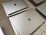 many laptops that are sitting on the floor together