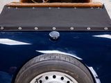 a close up of a blue car with a steering wheel