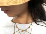 the woman is wearing a straw hat and a white shirt