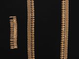 a gold necklace and earring set