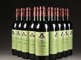 six bottles of wine are lined up in a row