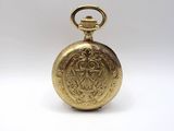 an image of a gold pocket watch on a white background