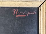 a painting of a black and gold frame with a red inscription on it