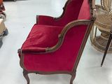 a red chair that is sitting in the middle of a room