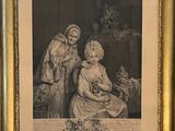 an old picture of a woman and a child sitting in a chair
