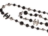 a close up of a rosary on a white background