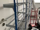 a ladder that is next to a shelf in a room