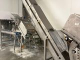 a picture of a conveyor belt in a factory
