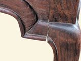 a close up of a wooden table with a wooden top
