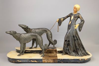 an image of a statue of a woman and two dogs