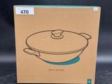 a cardboard box with a drawing of a frying pan on it