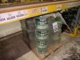 a large stack of cans on a pallet in a store