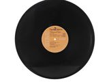 a black vinyl record with a white label on it