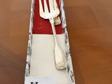 a fork and spoon in a box on a table