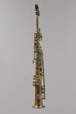 a saxophone hanging from the ceiling in the room