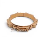 bracelet made of wood and metal with a clasp on a white background
