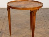 an image of a table with a wooden top on a herringle floor