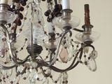 a chandelier with a bunch of glass beads hanging from it