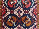 a blue rug with a red and yellow design on it