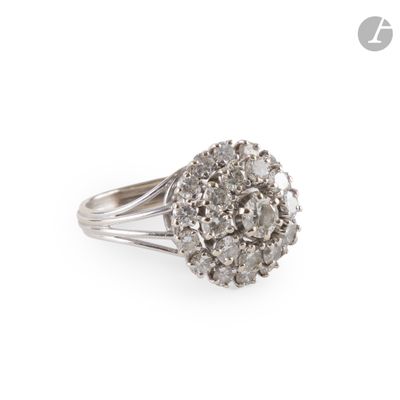 a close up of a diamond ring on a white background