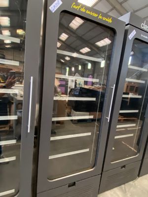 three glass doors that are open in a store