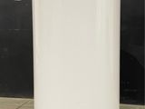 a large white water tank sitting on top of a cement floor