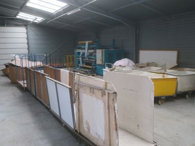many pieces of furniture in a warehouse that is being built
