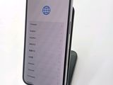 an image of a cell phone sitting on top of a stand