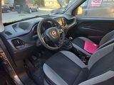 the interior of a small car with a steering wheel and dashboard