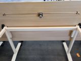 a bed with a white frame and a wooden headboard