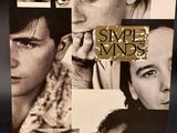 the album cover of simple minds is shown on a black surface