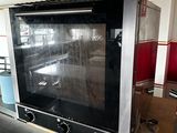 a large oven that is sitting in the middle of a room