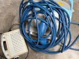 a blue hose that is connected to an electrical device