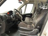 a view of the inside of a van from the driver ' s seat