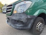 a close up of a green van parked in a parking lot