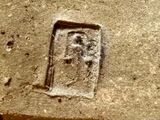a picture of a stone block with a picture of a man on it