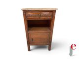 a small wooden table with a drawer on top of it