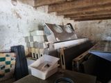 a pile of old appliances in a dirty room