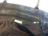 a black bag that is open on the floor