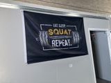 a sign that says eat sleep squat repeat repeat