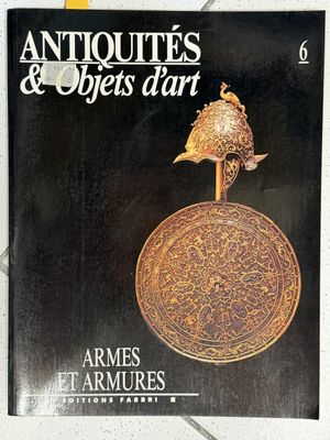 the cover of the book antiques and objects of art, featuring a bird on top of a coin