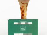 a small vase sitting on top of a green card