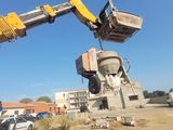 a man that is standing next to a crane
