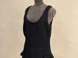a mannequin wearing a black dress with a crown on top of it